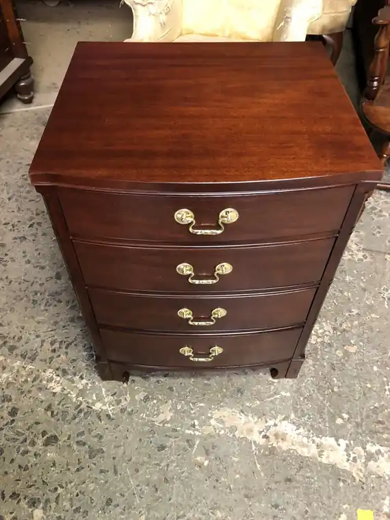 The same chest after refinishing, an even warm stain and a clear finish