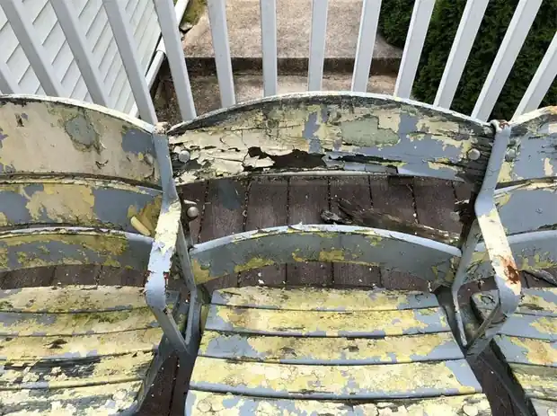 Stadium seating before restoration, the old paint peeling off