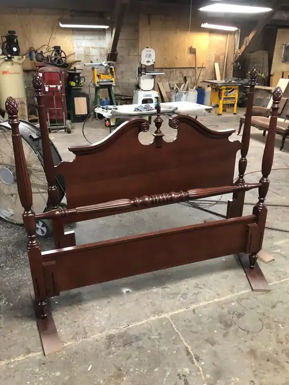 Mahogany four-poster bed frame with turned posts