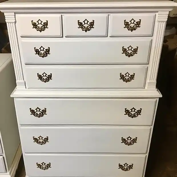 White painted chest-on-chest with rows of antique brass drawer pulls